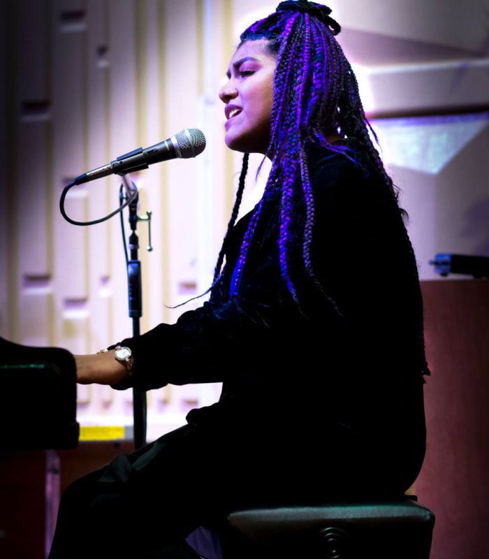 SPCPA-Arts-Music-Singer-at-piano-with-microphone